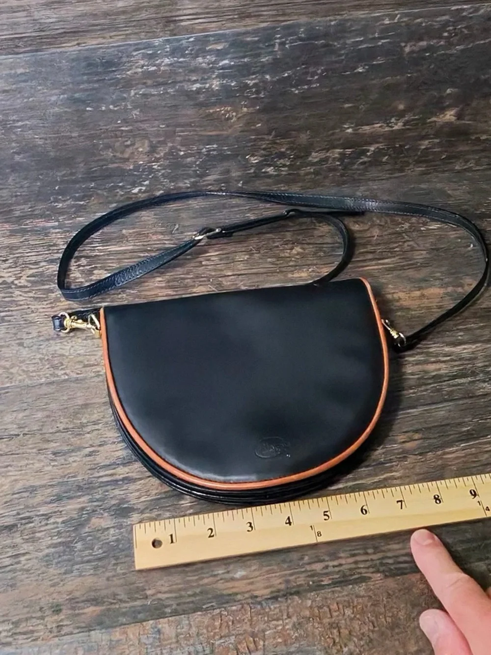 Leather Crescent Crossbody Bag in Black with Brown Trim